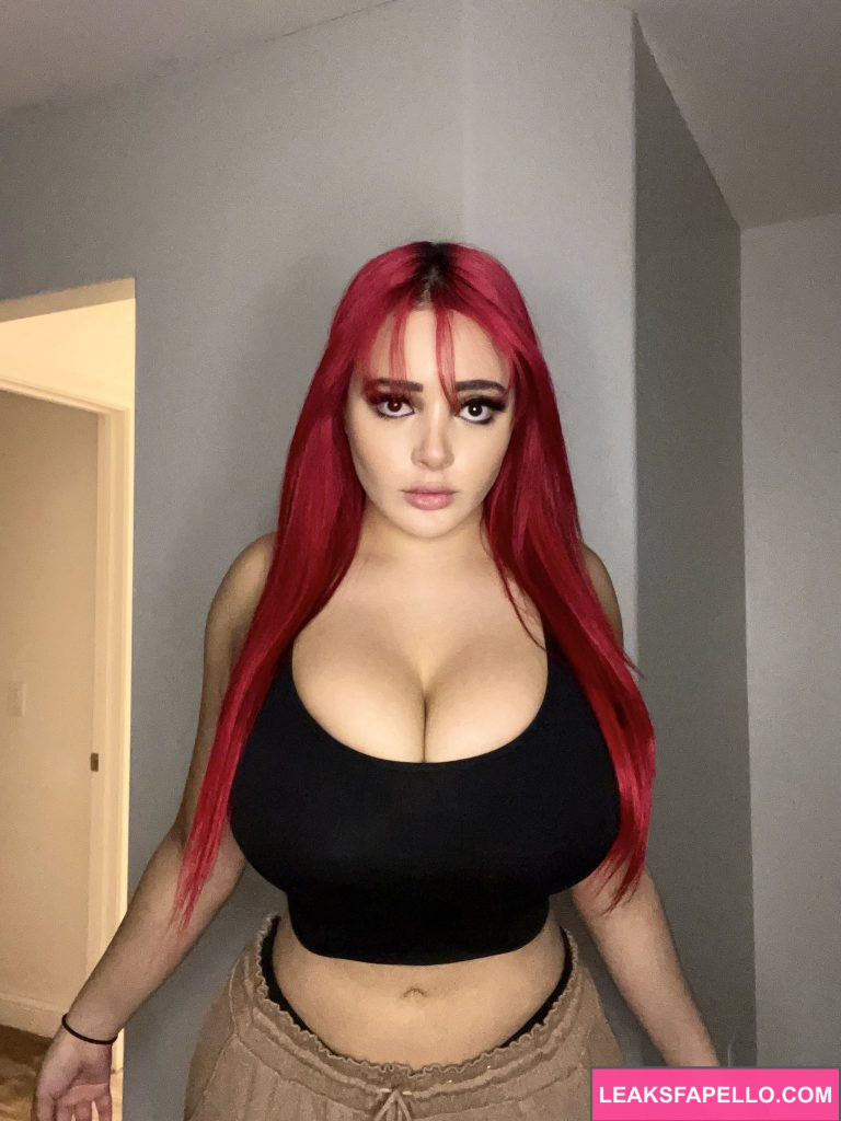 Brie Nightwood @brienightwood OnlyFans big tits red haired Only Fans model wearing black top and brown pants massive tits