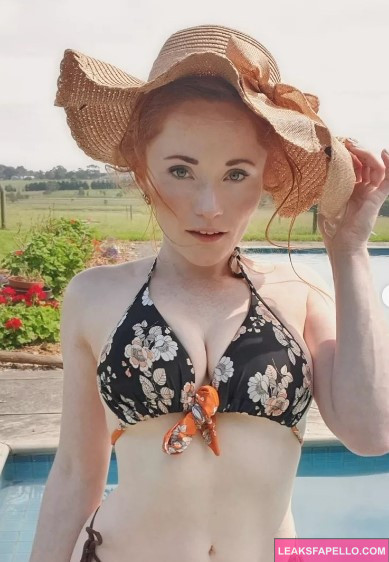 LoveAmyPond @loveamypond OnlyFans big tits redhead big tits thick ass hot sexy only fans model wearing sexy black two piece bikini and a hat by the pool