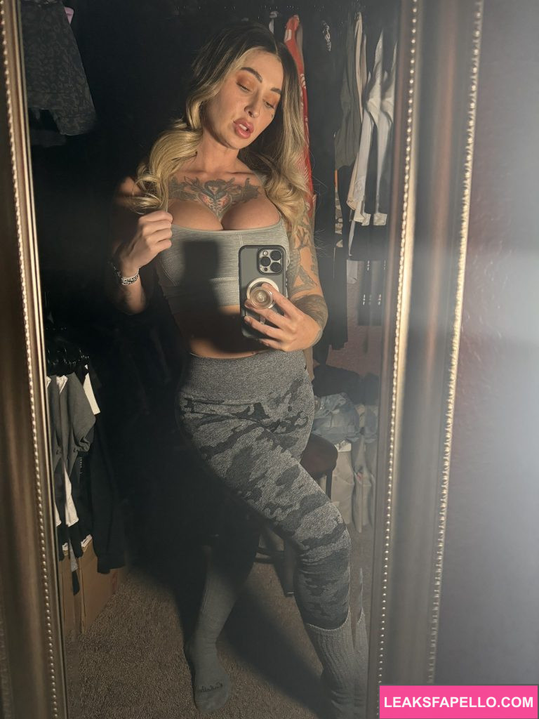 Kleio Valentien @kleioxxx OnlyFans big tits thick ass blonde onlyfans sexy model wearing grey top and leggings 