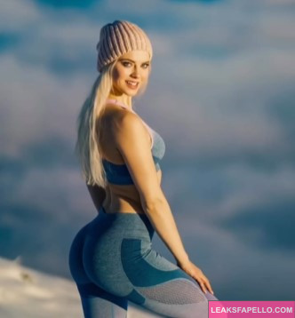 Peyton Kinsly @peyton.kinsly OnlyFans blonde big tits sexy only fans model wearing blue leggings and sports bra and wearing a bonet