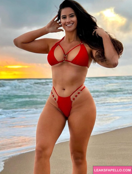 Marie Temara wearing a red bikini and takes a sexy beach shot