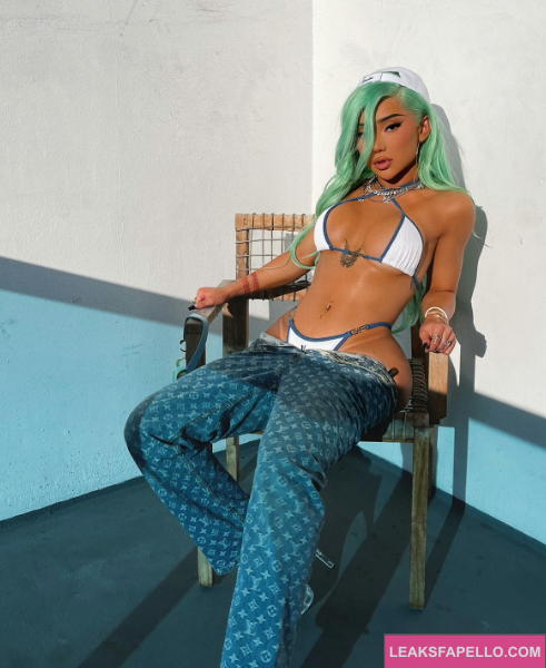 Nikita Dragun wearing a white bra and pant 