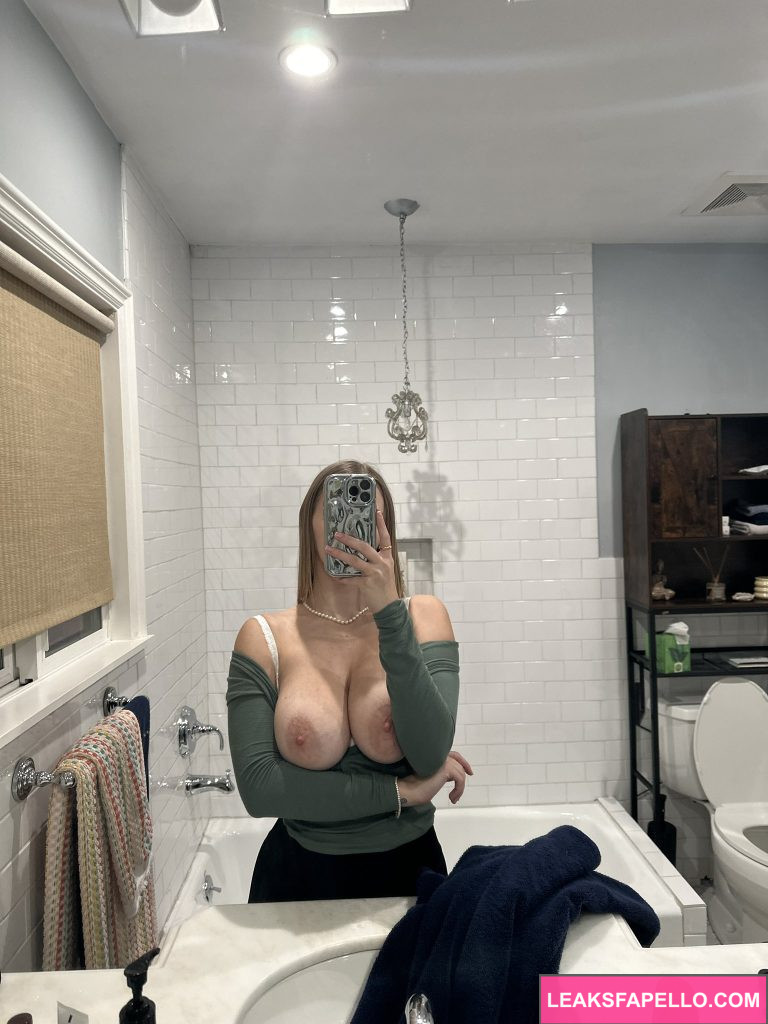 Angel Youngs @angelyoungsxxx OnlyFans big tits sexy big ass only fans model wearing long sleeves and black pants mirror shot in the bathroom