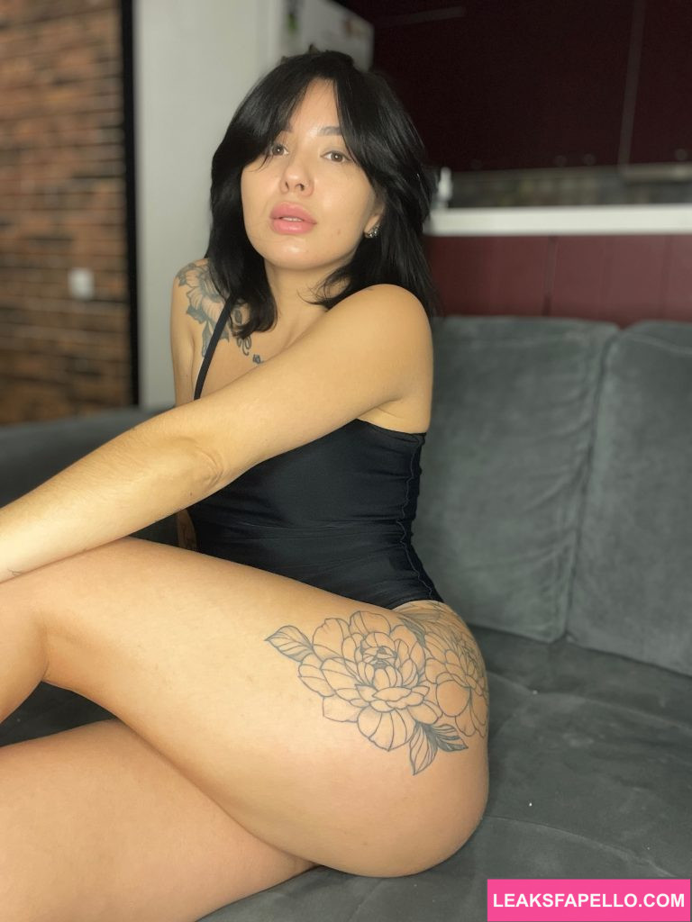 Ivy Illusion @ivyillusion OnlyFans hot sexy tattoed thick ass only fans model wearing black dress sitting on the couch