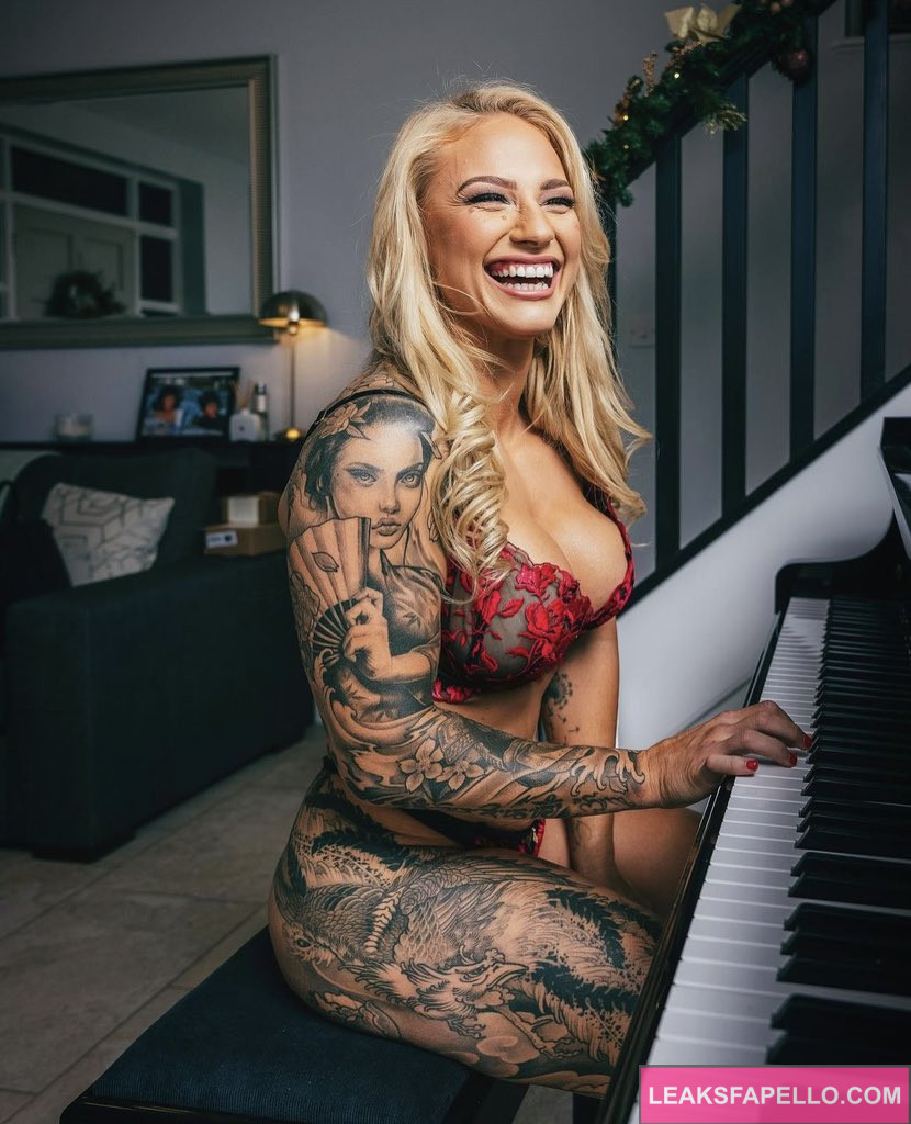 Ebanie Bridges @ebaniebridges OnlyFans blonde big tits milf busty only fans model wearing red lingerie playing the piano