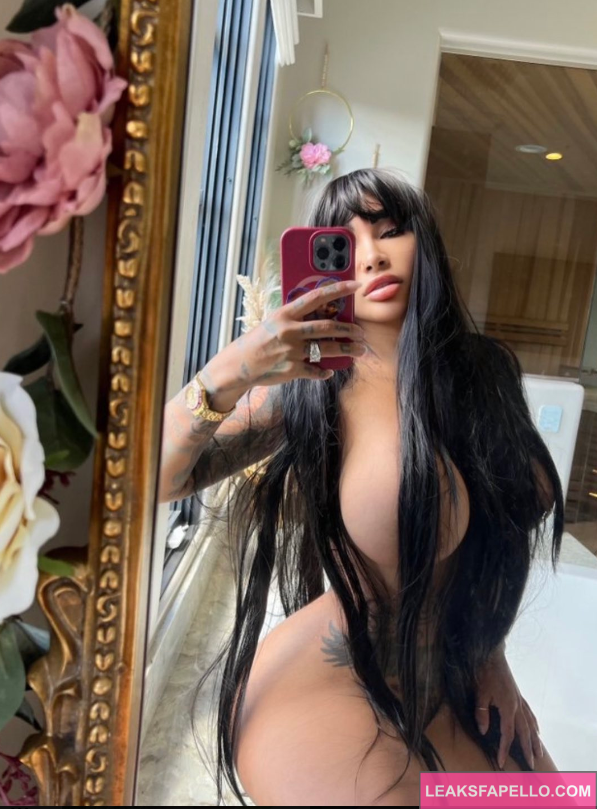 Brittanya O'Campo taking mirror selfie and covers nude nipples with hair