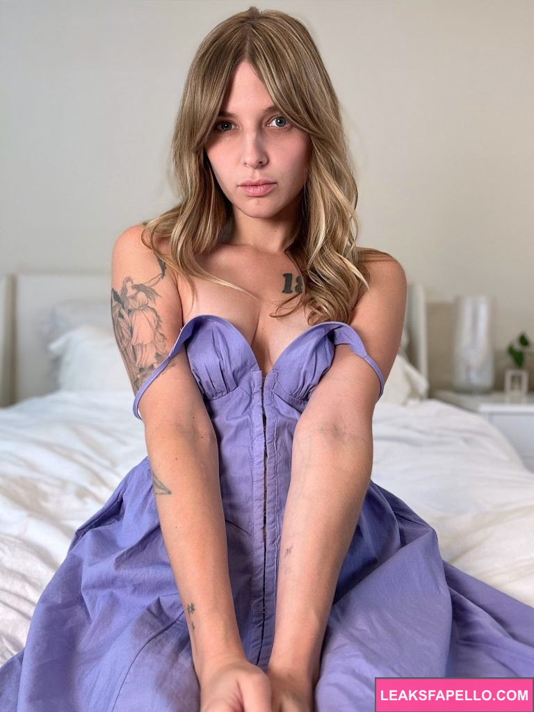 Paris Bush @parisbush OnlyFans hot sexy petite only fans model wearing a purple dress sitting on the bed