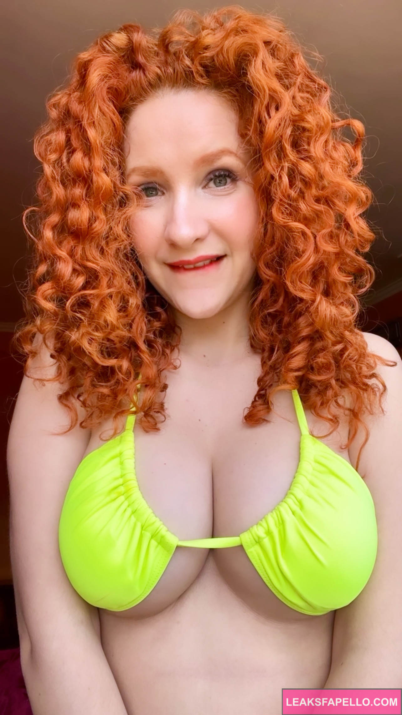 Ashley Ve @ashleyve OnlyFans curly red head only fans model wearing cyan green bras squeezing her tits