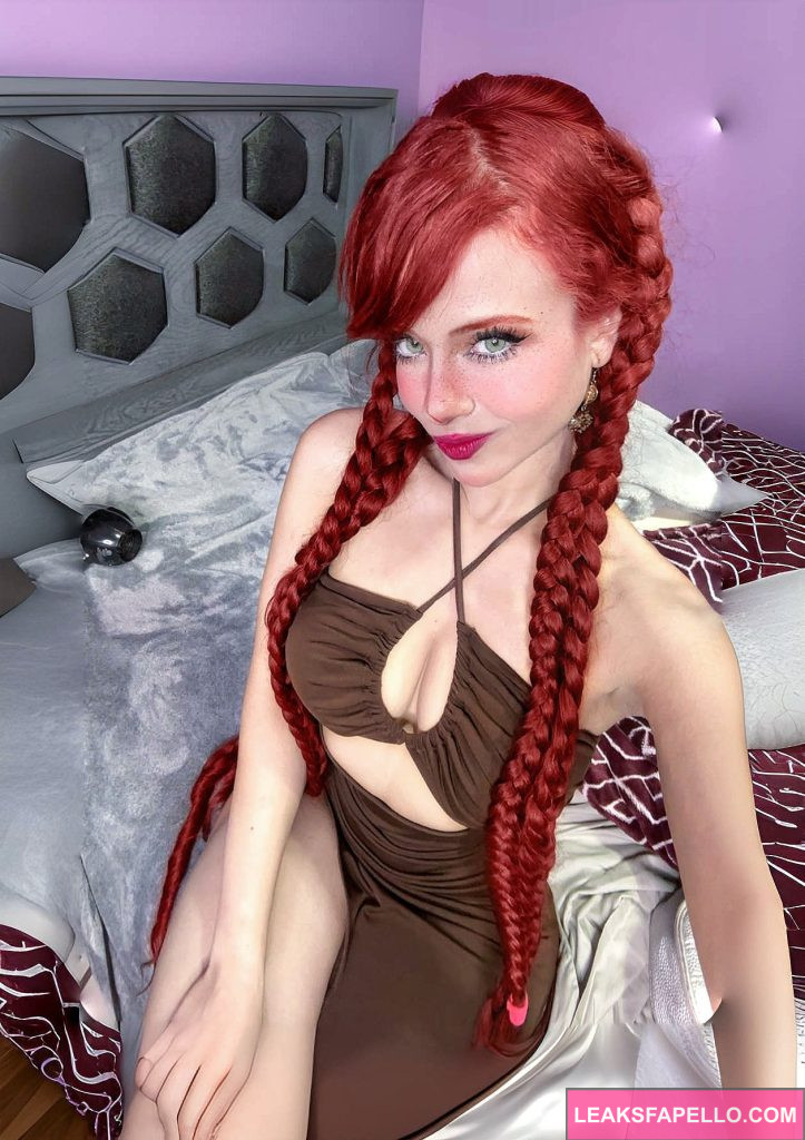 Bella Dueñas @belladuenas OnlyFans redhead big tits sexy tall only fans model wearing brown sexy dress sitting on the bed