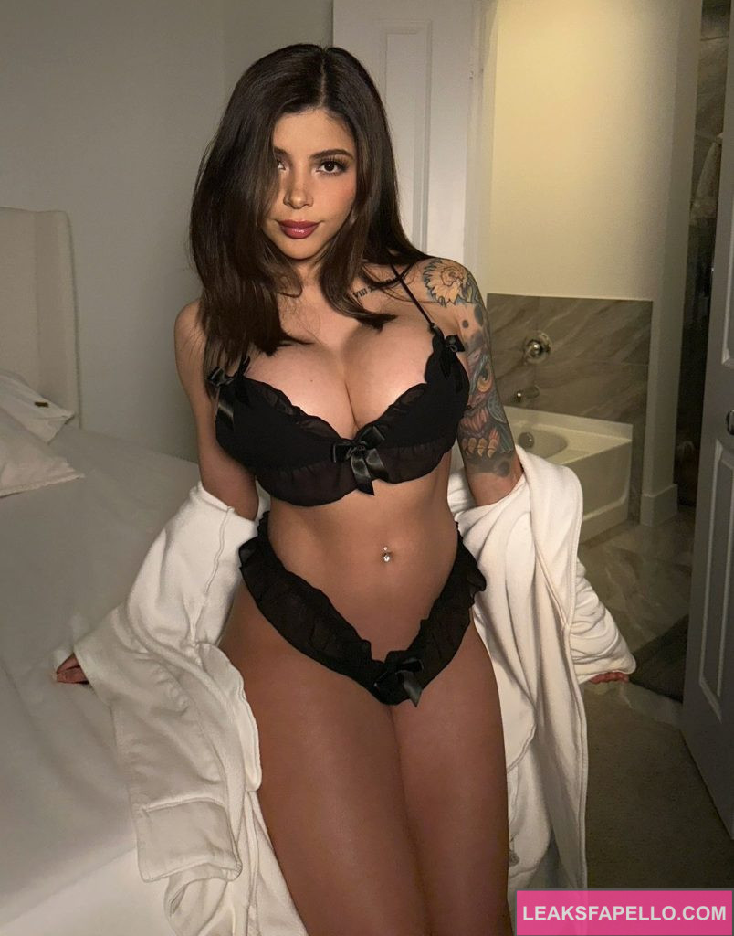 Skyler Lo @skylerlo OnlyFans big tits thick ass only fans model wearing black two piece sitting on the bed