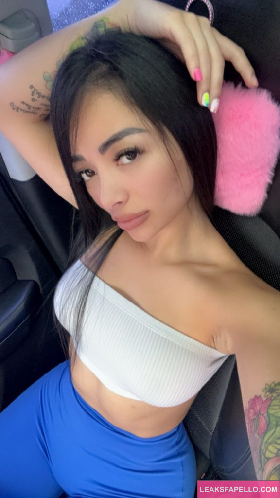 Melissa Alfaro @soymelialfaro OnlyFans big tits hot hick only fans model wearing white tube top and blue leggings sitting in the car