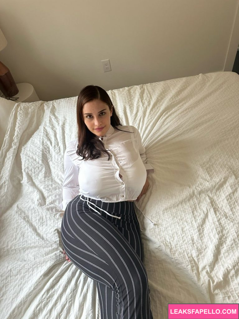 Kat Dunning @waifukatt OnlyFans big tits thick only fans model wearing white longsleeves on the bed