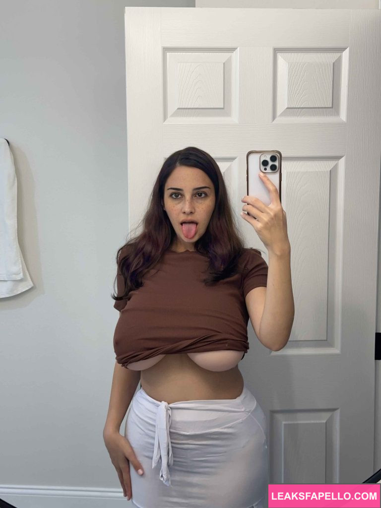 Kat Dunning @waifukatt OnlyFans big tits thick only fans model wearing brown shirt and white skirt mirror shot