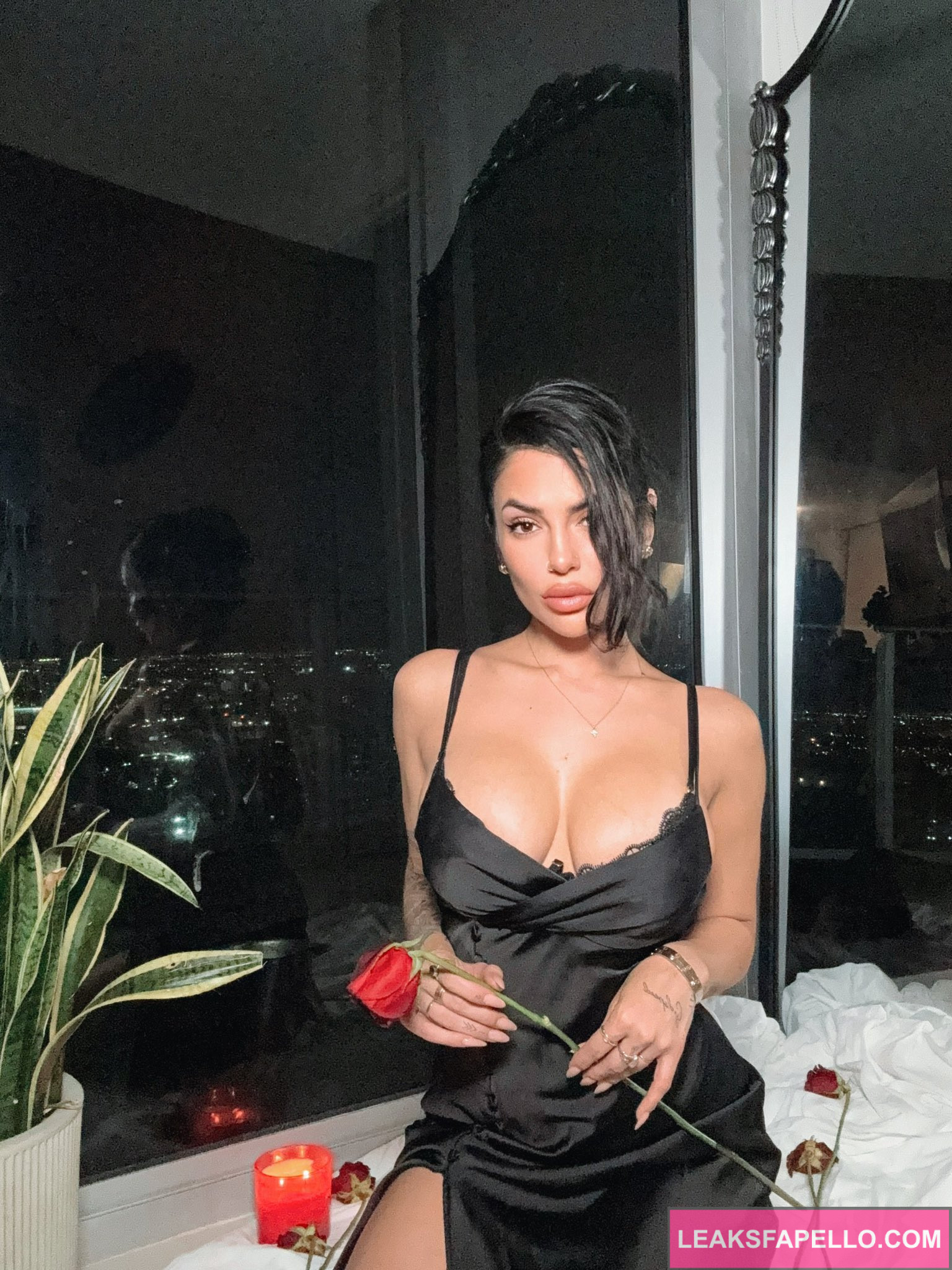 Luchi Del Mar @luchiexclusive OnlyFans big tits thick ass only fans model wearing black dress holding a rose