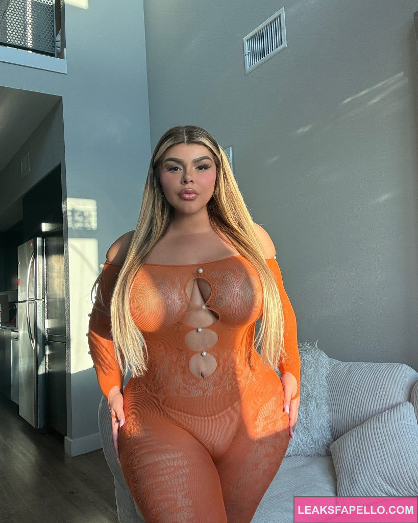 Shell Raven @shellravenvip OnlyFans thick busty only fans model wearing orange dress