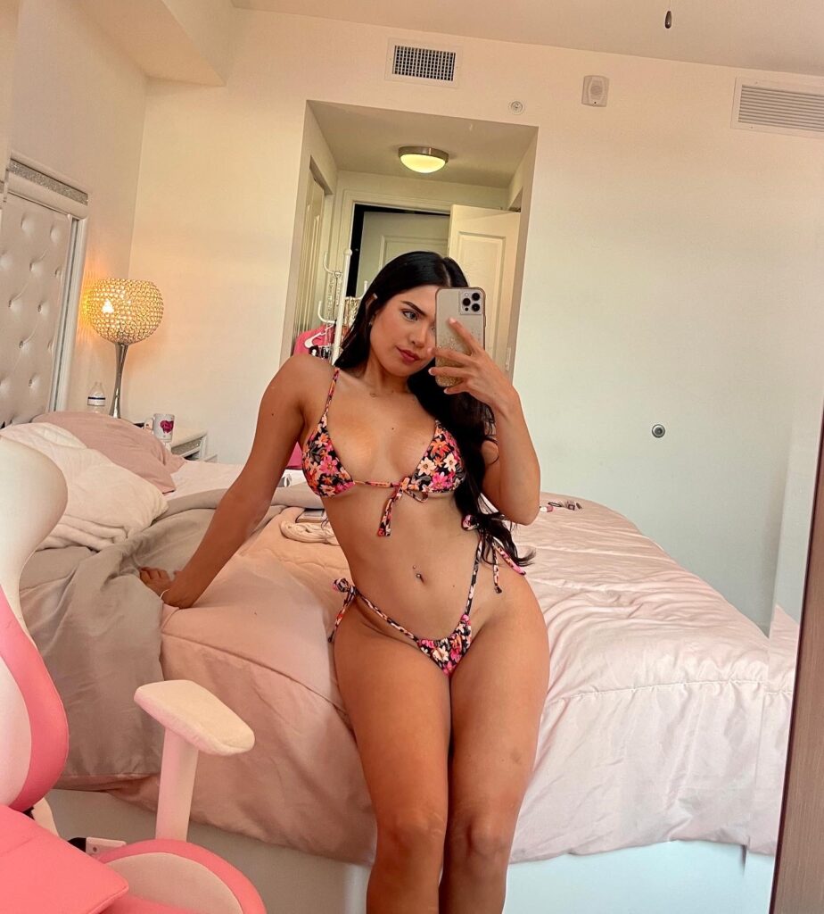 Karina Guerrero @karinaguerrero OnlyFans big tits latina model wearing sexy two piece bikini sitting on the bed