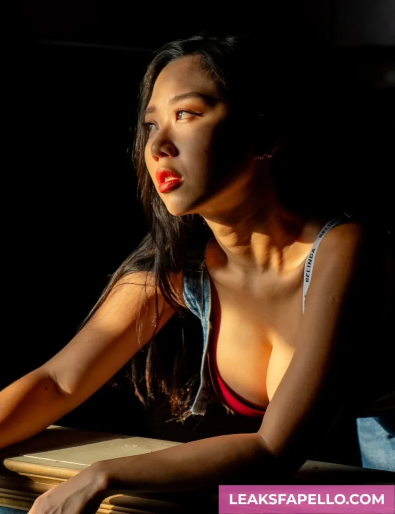 Sharon Wei wearing a jumper suit over red lingerie