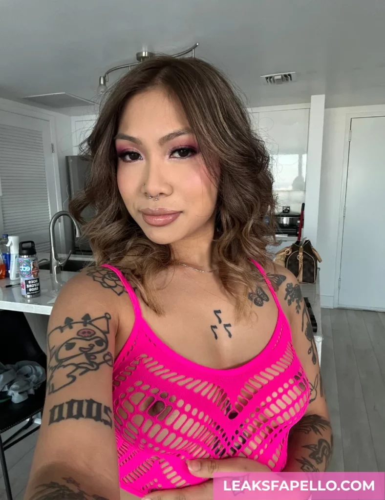 Yumi Sin wearing fuchsia pink net style crop top