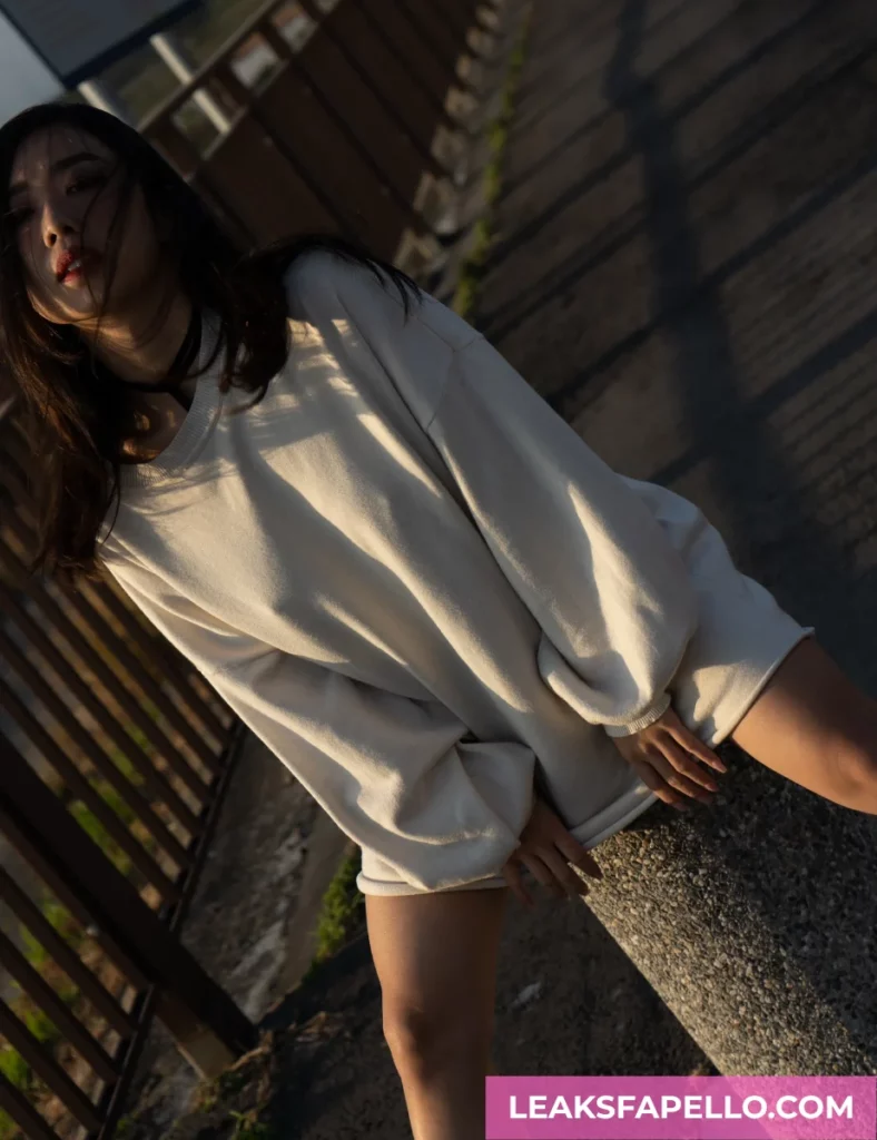 Sharon Wei wearing a white oversized jacket