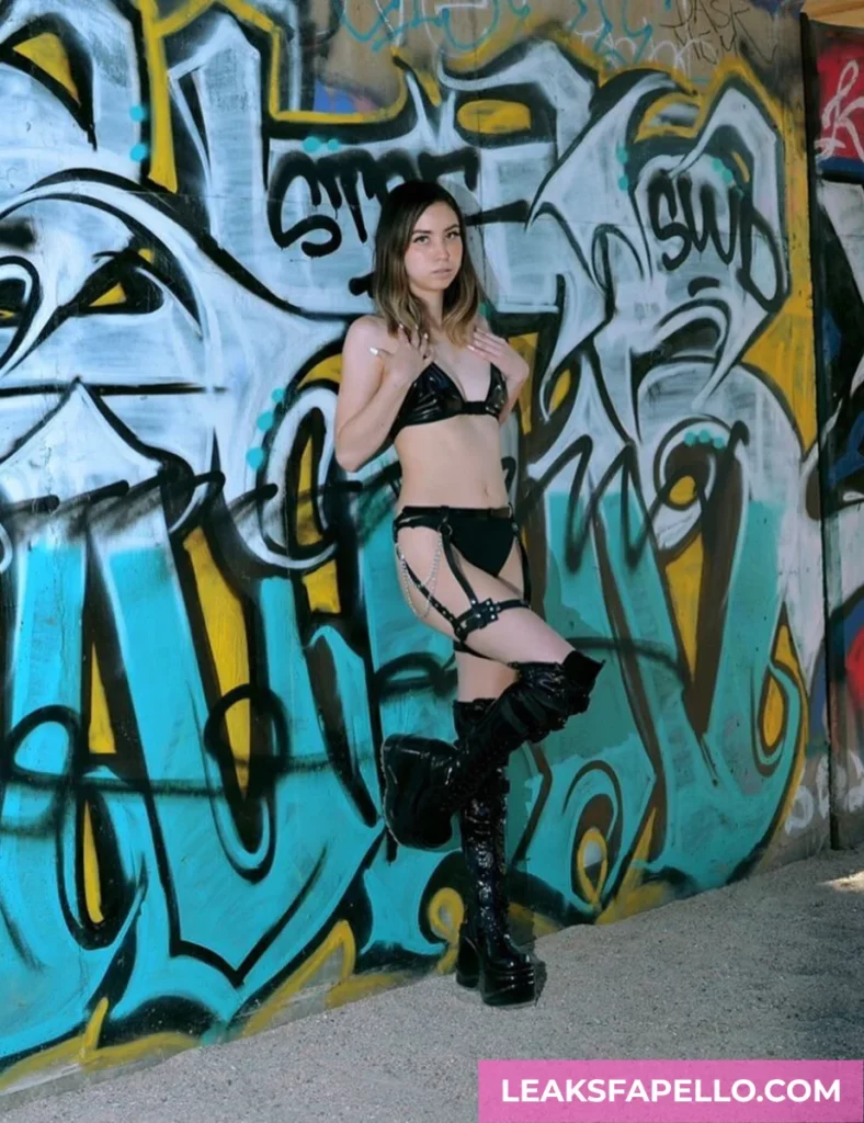 Amber Angel, Slim Petite Curvy OnlyFans model, wearing black lingerie and boots