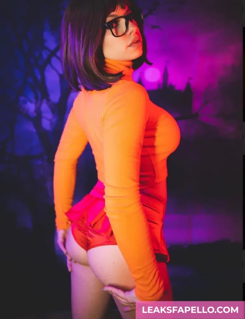 Dakota Quinn, Tattooed Busty Curvy OnlyFans model, as Velma from Scooby-Doo
