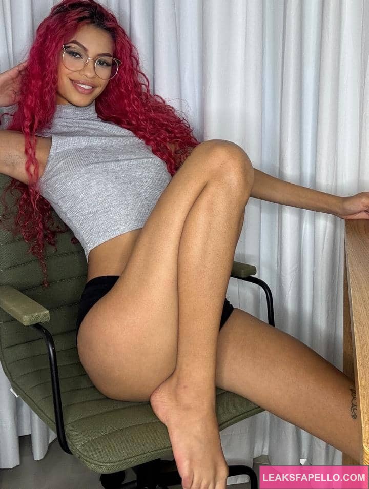 Renata Lima sitting in a sexy way