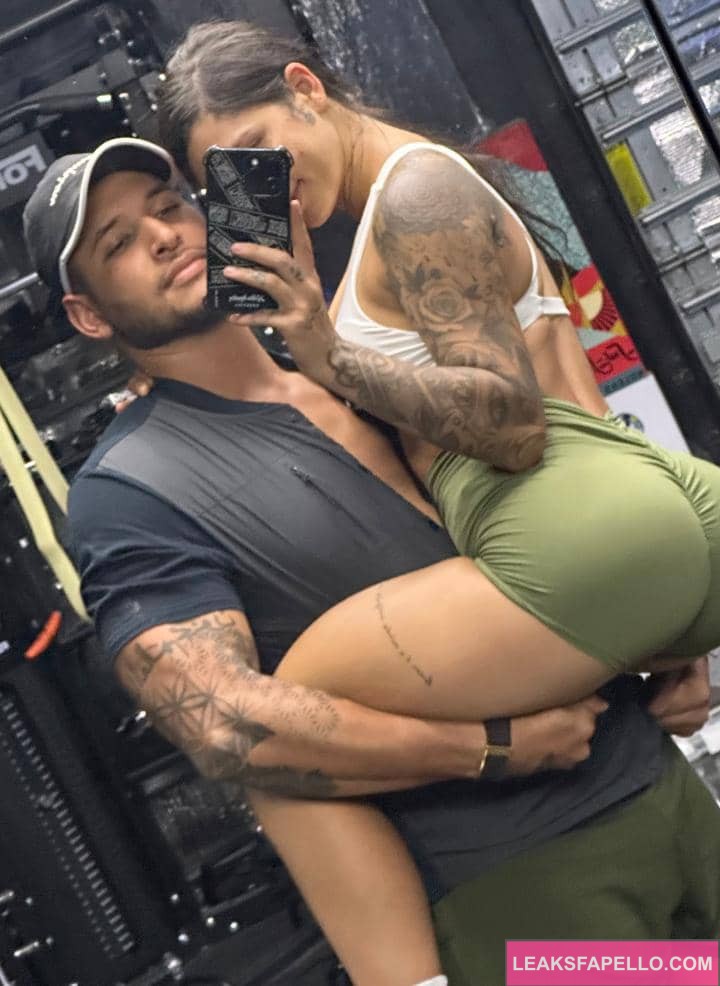 Gina Valentina being carried by her gym instructor