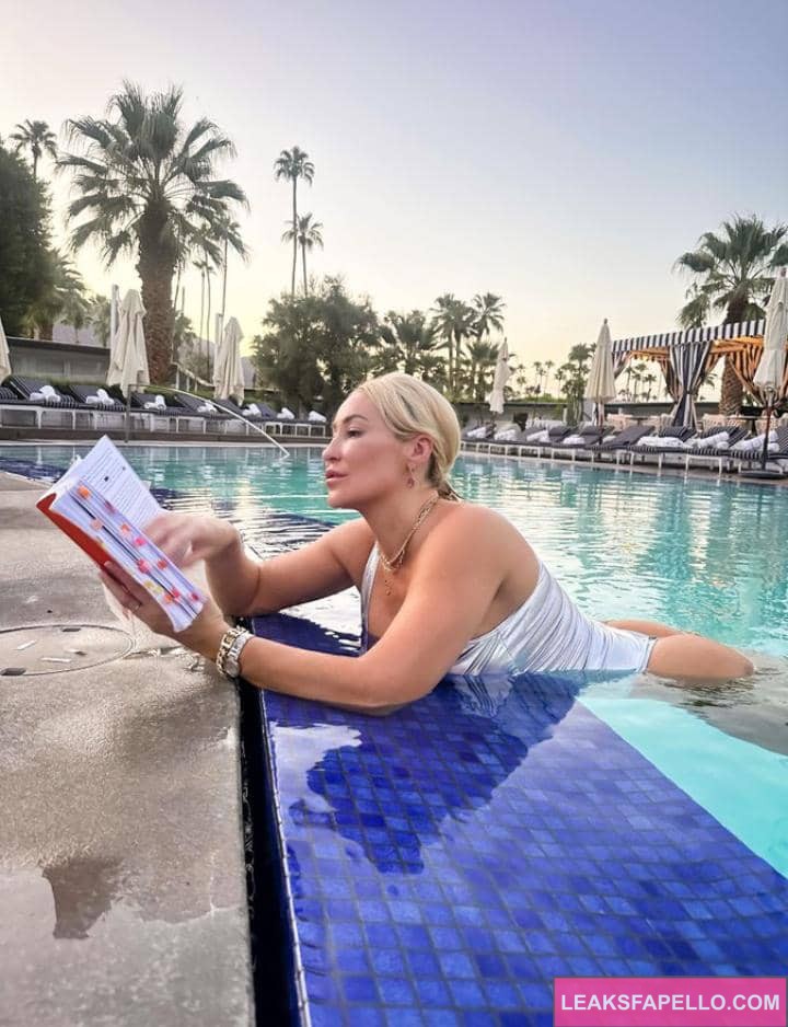 Ryan Keely reading a book in the pool 