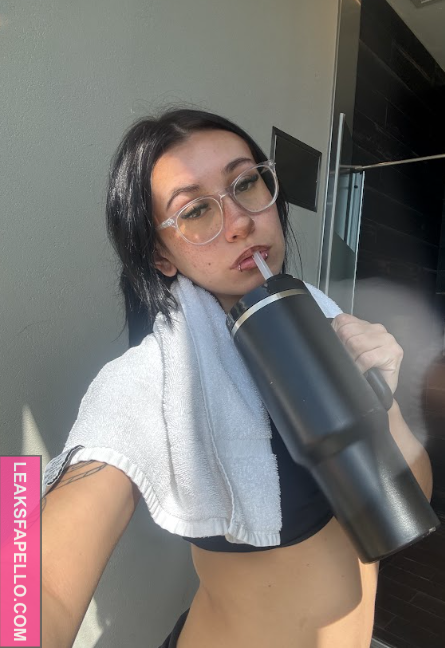Lola Knox sipping from a water bottle