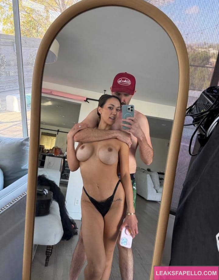 Sarah Caldeira getting hugged by Alex from behind with boobs out while they take a mirror selfie