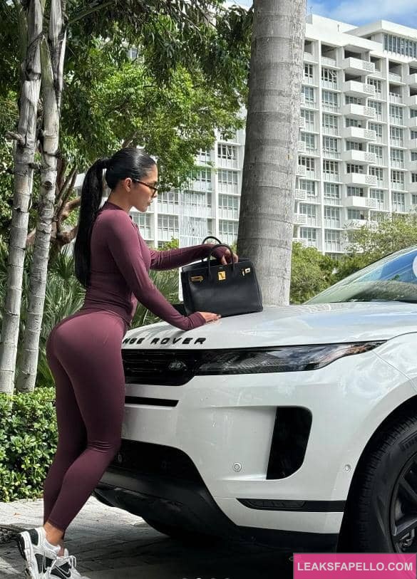 Amanda Trivizas besides a Range Rover 