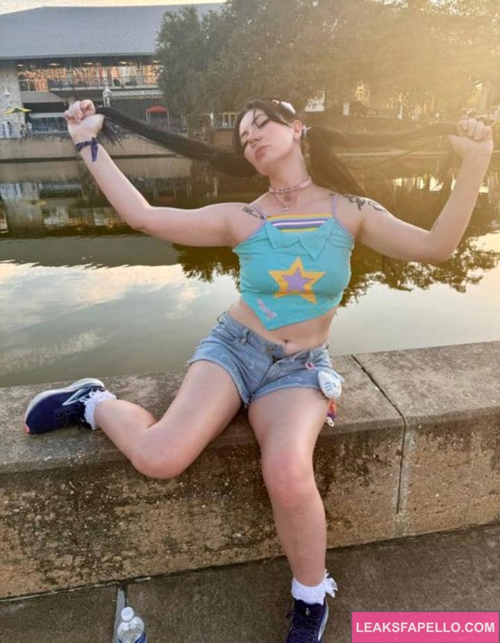 Reysuka enjoying the sun sitting near a pond