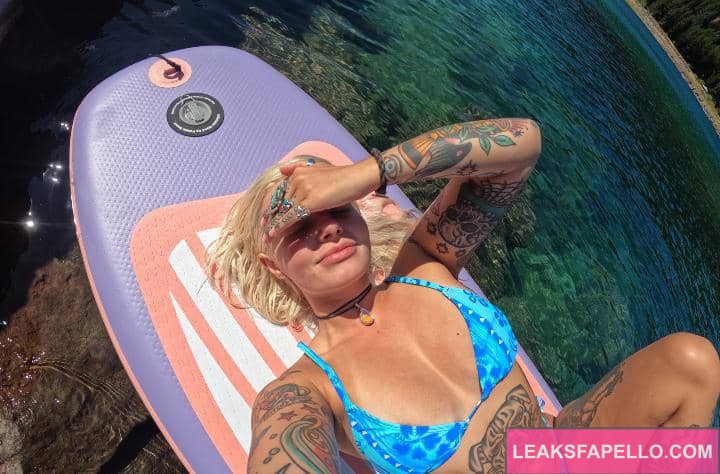 Emily Sedona on a surf board enjoying the sun