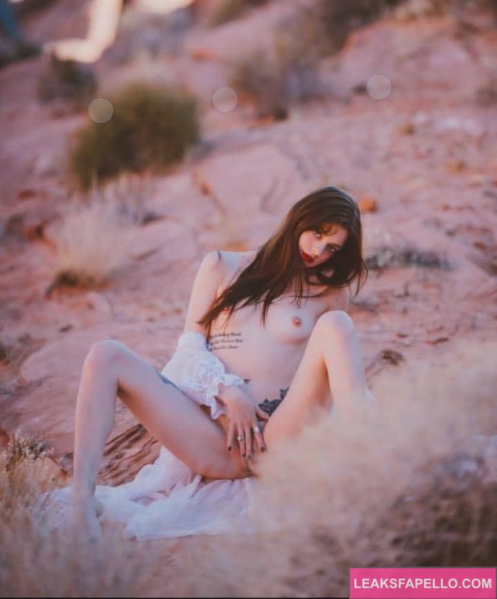 Olivia Wildin touching her pussy outside