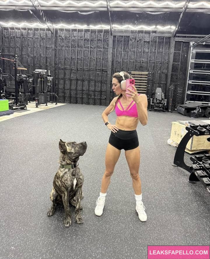 Bryce Adams taking a selfie with her pet dog
