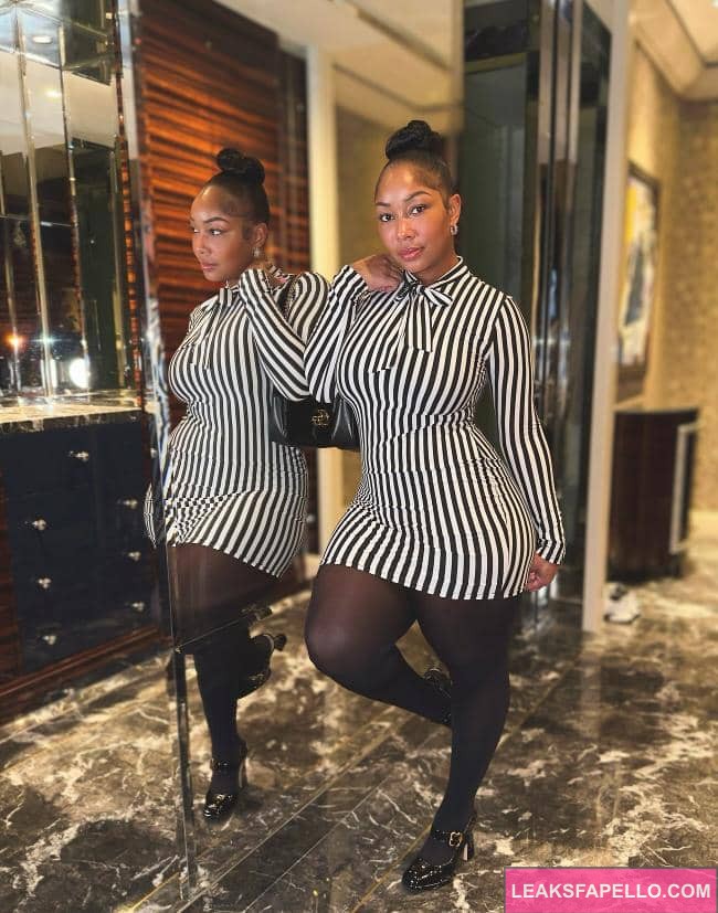 Candy Mary in a dress taking a sexy pose