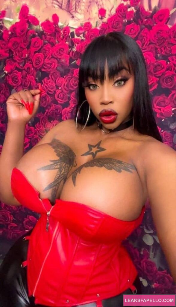 Victoria Cakes in a tight red dress showing off her cleavages